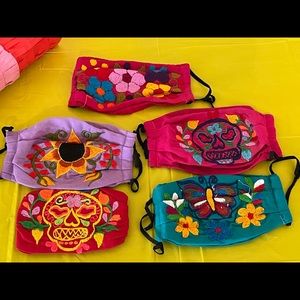 One size. Embroidered various colors and designs non medical face mask.